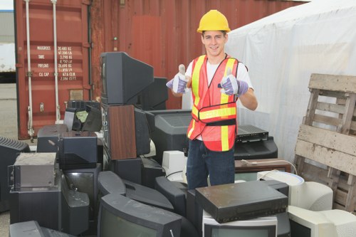 Workers organizing items during loft clearance